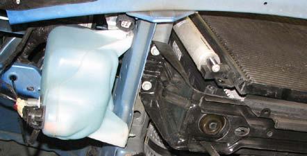 38. Remove lower airbox with 10mm socket to get to the driver side bolts on the radiator saddle. 39.