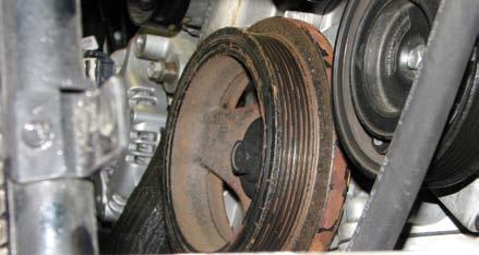Use a 3/8 drive breaker bar to loosen the tensioner and remove the serpentine belt.
