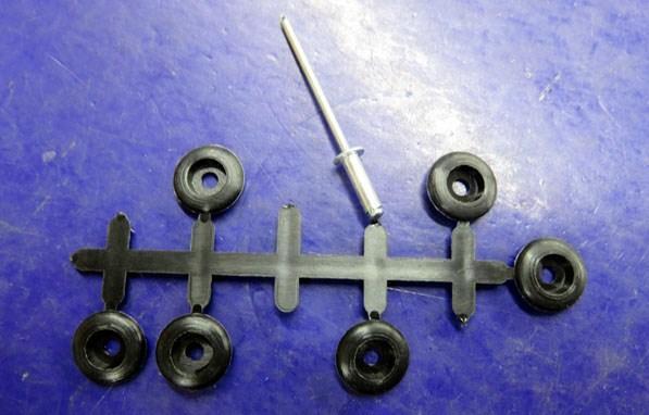 The rivet-on trim clips for waist mouldings that Moss used to supply were metal. The new ones they supply are plastic.
