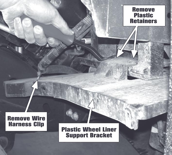 Remove the wheel liner support bracket plastic retainers and detach the wire harness clip. See Figure 3. 3. Use Template 1 (page 8) to place over the support bracket tab as shown in Figure 4.