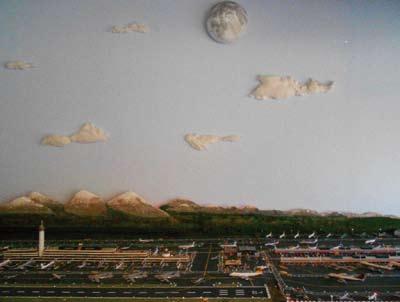 an active airport), over 500 carved people and trucks to scale, custom