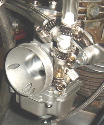 The jets can be changed easily whilst the carburetor is mounted in place on the bike. Fig.