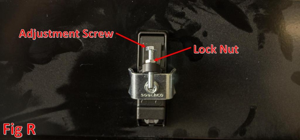 Then, adjust the screw until the latch is able to close, but also holds the door shut without any play.