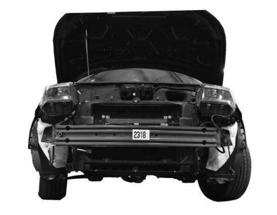 d. Pull the fascia away from the vehicle and set it to the side on a soft surface. 2.) Cut the driver and passenger side bumper mounting holes in the front bumper fascia: a.