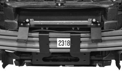 Installation Manual 7 b. Center the plate by measuring 13-13/16 from the passenger side edge of the first factory bumper angle to the edge of the plate. c.