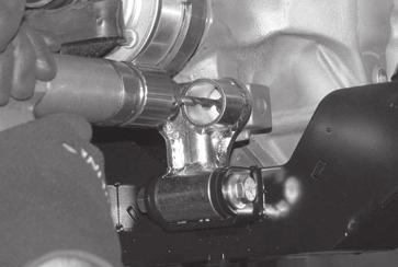 32. Use the rear bracket as a drill guide to drill a ½ hole through the block on the rear of the diff. SEE FIGURE 33 36.