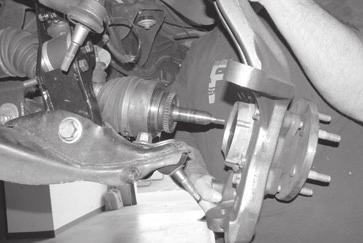 SEE FIGURE 49 Once clearance is available, install the halfshaft outboard end into the wheel knuckle hub bearing.