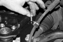 Use an FTCLAMP, 1/4-20 x 1 bolt, nut, and washer to connect the brake line to the control arm.