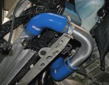 Drain the coolant by releasing the spring clip on the bottom radiator hose.