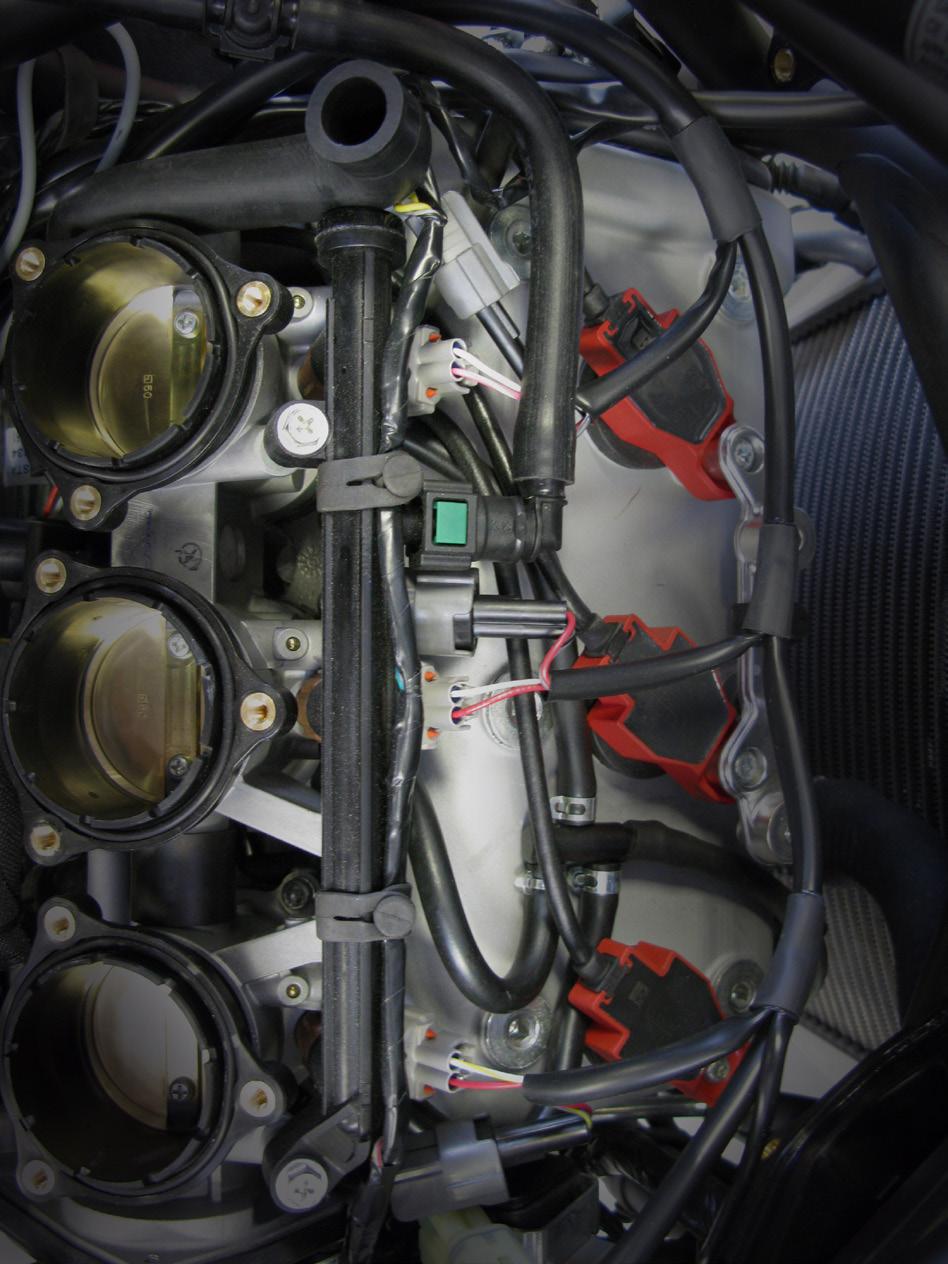 5>CONNECT (CONT.) 5.5 1. Continue to route the Bazzaz fuel harness up the left side of the frame, around to the front of the throttle bodies. 2.