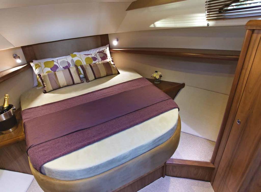 Interior FORWARD CABIN Large island double berth with side steps and two large drawers below, access to chain locker forward of berth.