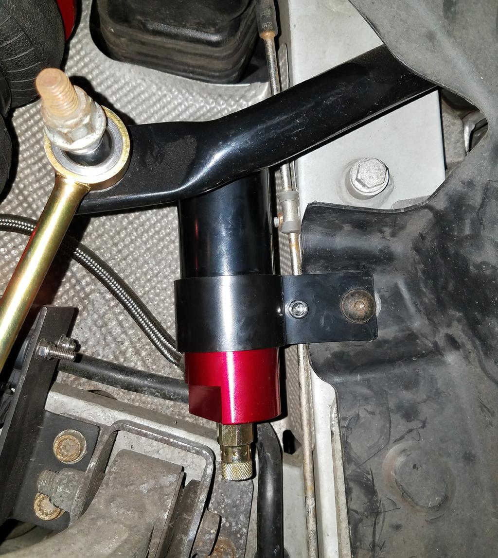 7. Reinstall the fender liner. Torque bolts to 10Nm (89 lb.-in.). 8. Attach the reservoir bracket to the chassis as shown, using a previously removed bolt to secure the fender liner in place (Fig. D.