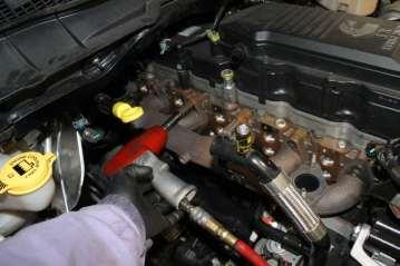 Remove 12 (13mm) bolts on exhaust manifold and remove exhaust manifold. 29.
