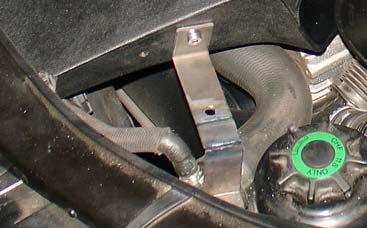 Figure 71 An allen wrench is used to fasten the bolt to the air scoop nut