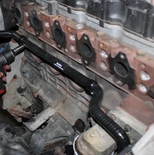 on 2010-12 models Adjust insulated clamps to prevent coolant hose from rubbing.