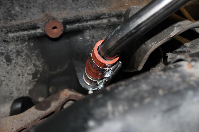 Install the four supplied studs into the manifold (short thread into manifold) with the