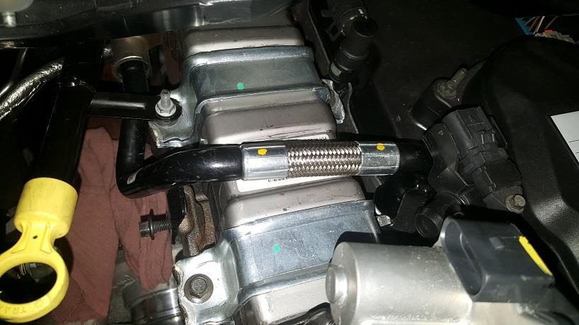 Remove the upper and lower EGR heat shields by removing the two