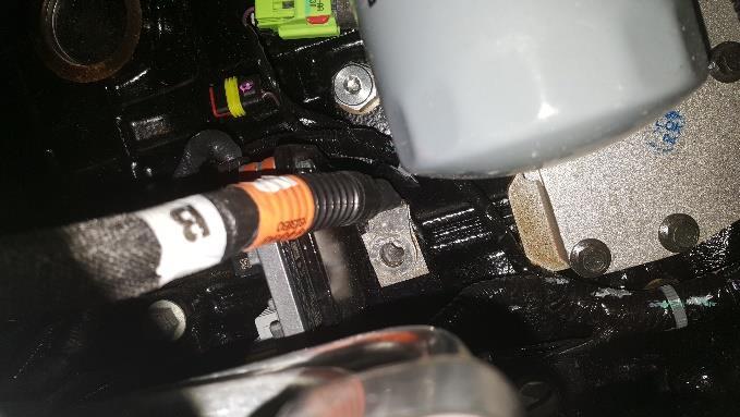 Remove the rear two exhaust manifold bolt