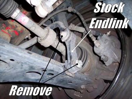 » First, remove the lower engine brace from the subframe and engine.