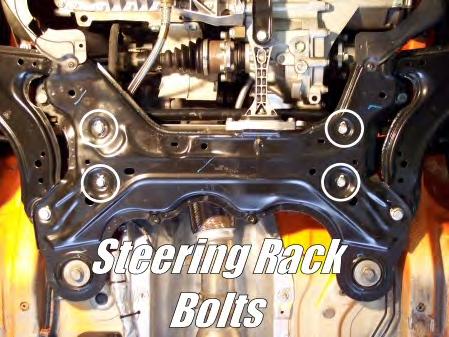» Now, remove the 4 large bolts that secure the subframe cradle to the body using a
