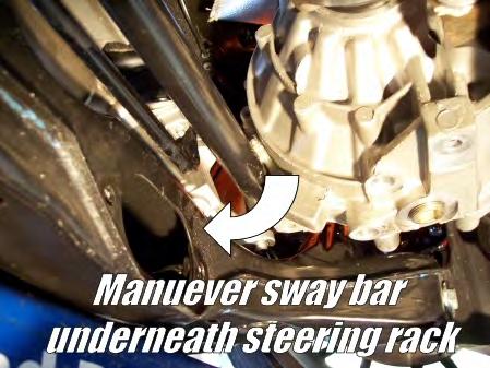 » Maneuver the sway bar around below the steering rack and remove from the vehicle.