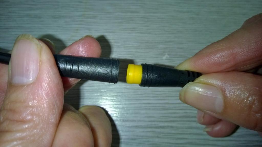 The brake cut-outs mate with the red connectors, the twist-grip mates with the yellow connector, and the lead from the display (which has a green connector) mates with the