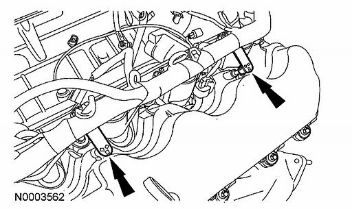15. Disconnect the 2 engine wiring harness retainers from the LH valve
