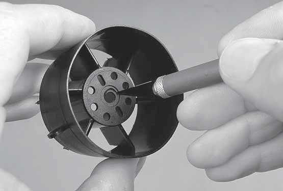 4. Use a hobby knife to enlarge the hole in the fan housing to accommodate the adapter shaft on