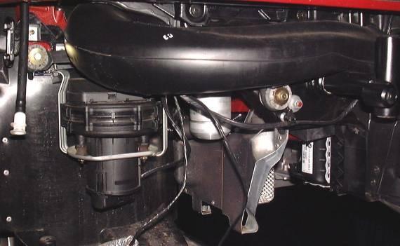 In order for the Right Intake Tube to fit, the air pump must be relocated using the brackets provided, and a portion of the tray that the air pump mounts to must be