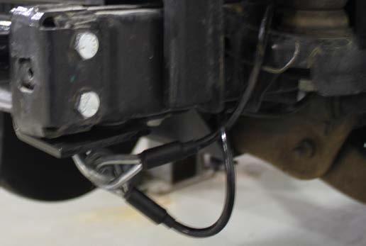 13. Attach the permanent baseplate safety cables to the provided convenience link on the baseplate. The photo above shows the recommended installation of the cables to frame of vehicle.