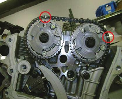 Each intermediate drive shaft sprocket drives separate secondary timing drive chains, which drive the respective cylinder head's intake and exhaust camshaft position actuators.
