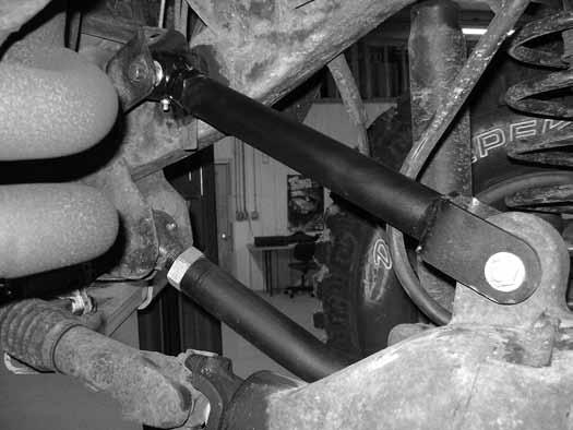 Axle End Frame End Bend Down Figure 4 26. Remove the upper control arms from the front axle and frame. Retain hardware. Note: Be sure that the axle is well supported. 27.