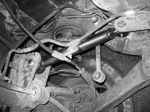 Leave hardware loose. 20. Remove the driver's and passenger's upper control arms from the axle and frame mounts. Retain all hardware. 21.