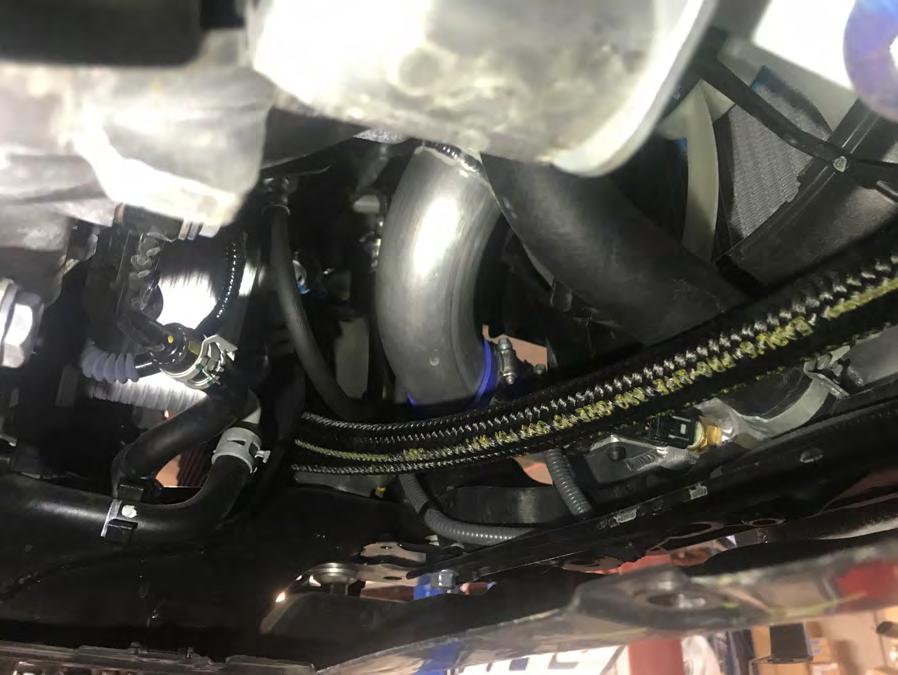 2.4 Connect the oil line between the sandwich adapter block fitting and the oil cooler. The 90deg fitting goes to the sandwich adapter block side and points down.