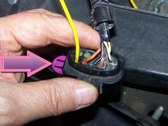 Plan ahead: route the wire(s) so you can come back later and tidy up with wire loom and ties (see Step 26). Step 9. Route one of the two yellow wires from the relay harness to a headlight connector.