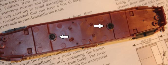 3. Unscrew the small cross-head screws on the centre line of the chassis unit, which hold the bogies in place.