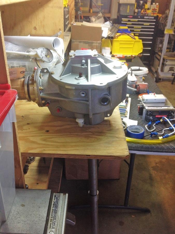 Here s the transmission supported by the shelf with the hole in the middle and ready for the operation to begin.