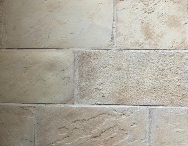Style: Monument (Color shown is Texas Cream) Minimal surface texture. Installed with ¼ or smaller grout joint.