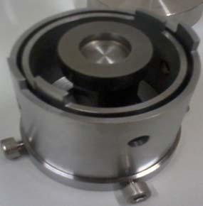 cylinder, the base with the protruded cylinder and the rotating cap) were manufactured from DIN 1.