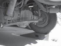 Note: the center bend in the anti-sway bar should go up Use the D- shaped washers and nuts to secure. The bar is not centered front to rear on the brackets, but is centered with respect to the axle.