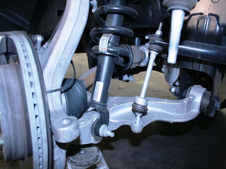 8. Remove the lower strut bolt and nut.