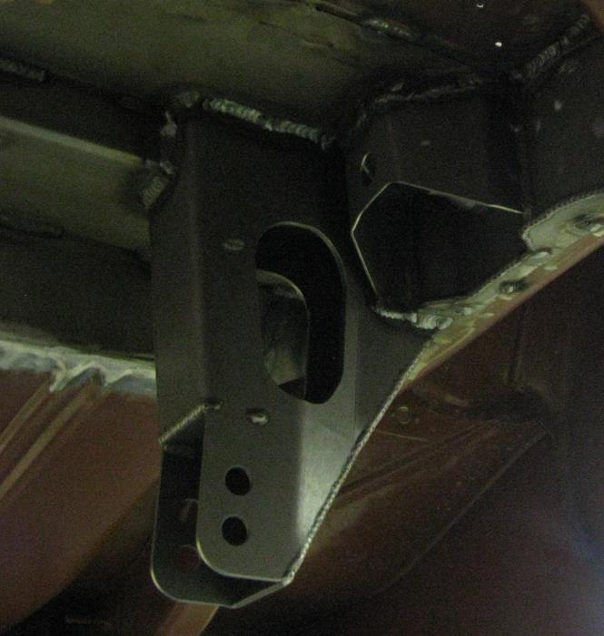 Tack weld the brackets in place, verify their position, and then weld fully (See Figure 6). Figure 6 Lower Link Bracket 8. Install the body side track bar bracket a.