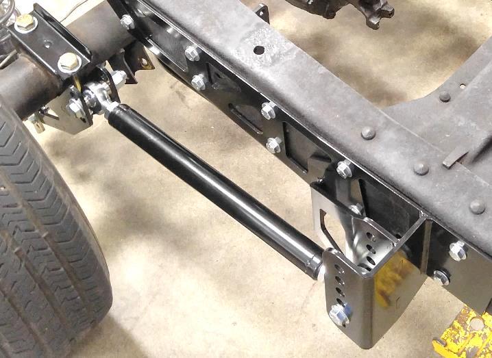 21. Position axle under the frame and connect coil-overs to notch