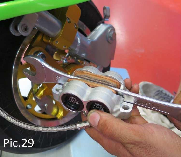 Before you start to bleed the system, insert a large spanner into the gap between the brake pads i.e. into the gap where the actual disc would normally sit (see Pic.