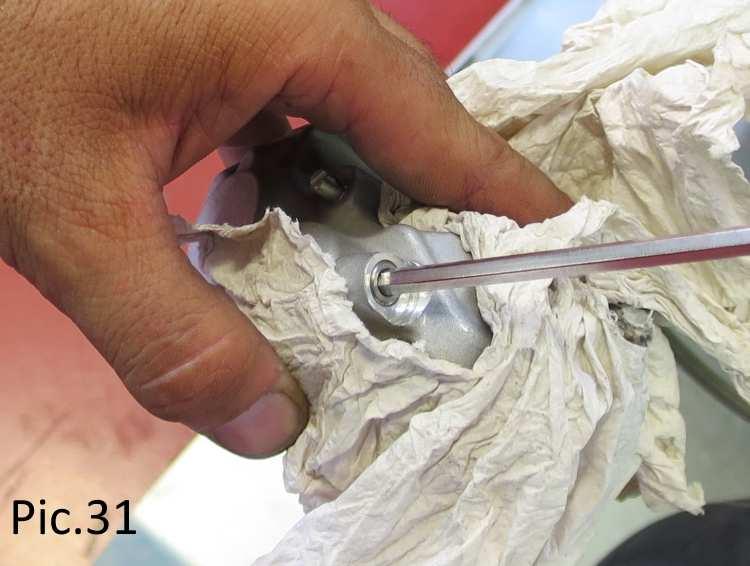Use a rag or paper to absorb any initial hydraulic fluid that is emitted from the bleed valve (see Pic. 31).