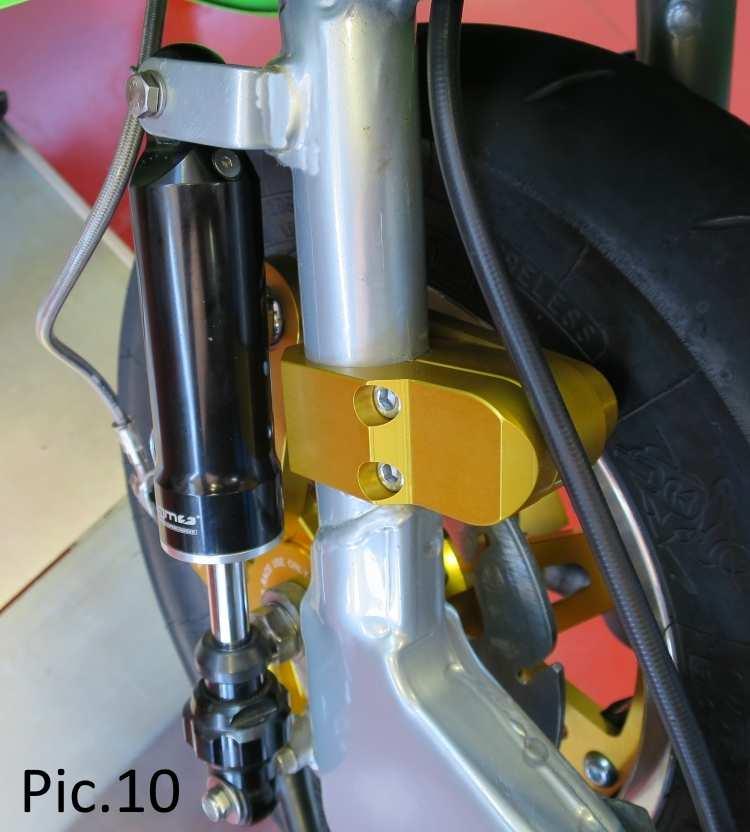 If the fork leg clamp has been placed too high and the distance between the two rods is more OPEN towards the front of the scooter (see Pic.