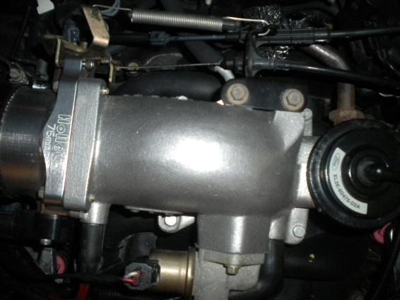 The cruise-control harness is removed by simply pulling upwards on the fitting connected to the throttle body.