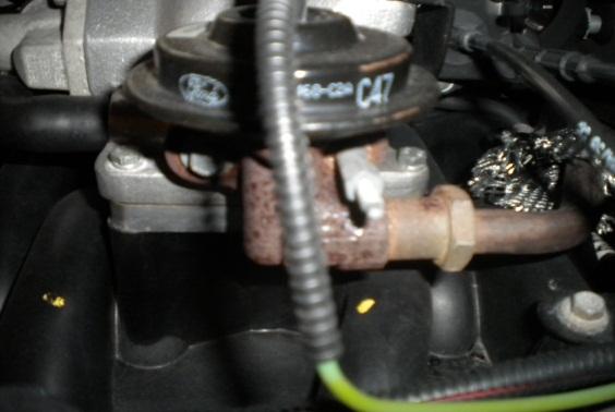 8. Remove the (2) 10mm bolts connecting the EGR valve to factory intake