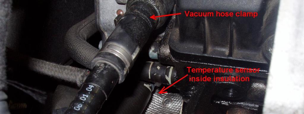 Unclamp the large vacuum hose from the pump, and