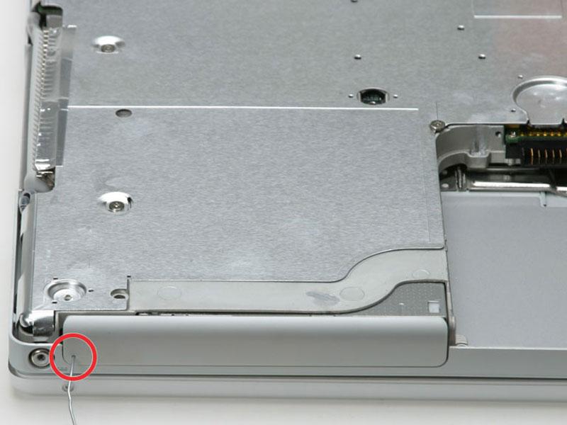 5 mm Phillips near the latch mechanism (this screw may be missing in 800 MHz ibooks) One 14.